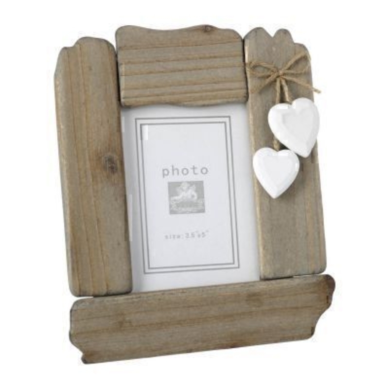 This is a lovely Wooden Frame with Hearts by Heaven Sends. The frame is in a driftwood frame style. The white hearts hang from a piece of twine attached to the top corner of the frame. Suitable for 3.5 x 5 inch photos. Size: 17x1.5x20.5cm